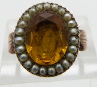Victorian ring set with a citrine in a foiled mount surrounded by seed pearls, size M
