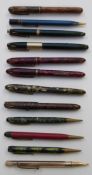 Twelve various fountain and ballpoint pens and propelling pencils including Waterman's 877,