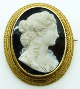 Victorian yellow metal large brooch mounted with an agate cameo of a young woman by Verge, in