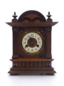 C1900 Carved Mahogany cased mantle clock, the ivory coloured Arabic chapter ring with beetle and