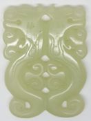 A 19thC pierced and carved jade panel with scrolling decoration, 6 x 4.4cm