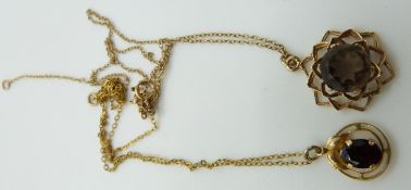 A 9ct gold pendant set with a garnet and a 9ct gold pendant set with a smoky quartz, 5g
