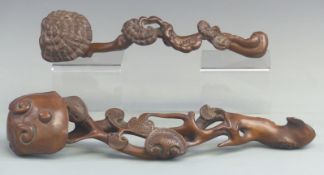 Two carved Chinese Ruyi sceptres, longest 42cm