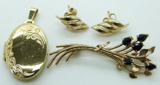 A 9ct gold locket, 9ct gold brooch set with sapphires and a pair of 9ct gold earrings, 6.7g