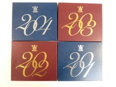 Royal Mint UK proof coin sets comprising 2001-2004 inclusive, with booklets