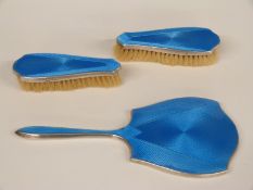 George V Art Deco hallmarked silver and blue guilloché enamel three-piece dressing table set,