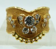 A yellow metal Indian ring set with cubic zirconia, 3.2g, size R