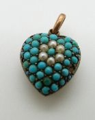 Edwardian heart pendant set with turquoise cabochons and seed pearls, engraved 1902.