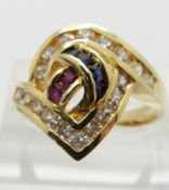 A 14ct gold ring set with square cut cubic zirconia, sapphires and rubies