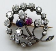 Victorian brooch in the form of a crescent with central flower set with old cut diamonds, the
