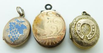 Three Victorian lockets, one with engine turned detail and enamel grape decoration, another with a