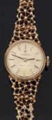 Tissot Stylist 9ct gold ladies wristwatch with two tone hands and baton markers, gold face and