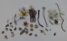 A collection of costume jewellery including a pair of yellow metal earrings, a silver fob chain,