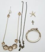 A white metal necklace, silver bangle depicting a leopard by G.Raspini, a silver and marcasite