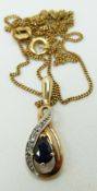 A 9ct gold pendant set with a sapphire and diamonds, originally bought from Beaverbrooks, 2.4g