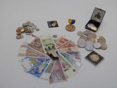 A collection of modern crowns, banknotes etc