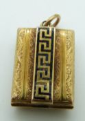 Victorian gold locket set with enamel in a Greek key design and engraved foliate design, 1.5 x 2cm
