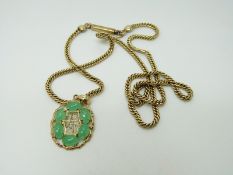 A 9ct gold necklace with 14k gold pendant set with jadeite cabochons, 11.2g