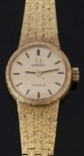 Omega 18ct gold ladies wristwatch ref. 7247 with black hands and baton markers, gold dial and signed