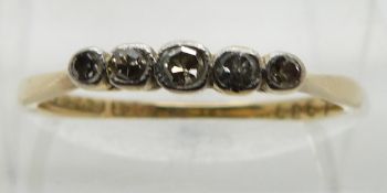 A 18ct gold ring set with five old cut diamonds, size L