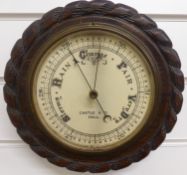 A circular aneroid barometer, c1930s, by Castle and Co, Hull, the painted ivory coloured dial with
