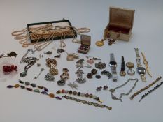 A collection of costume jewellery including bracelets, tiger's eye pendant, Miracle necklace,