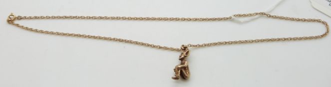 A 9ct gold pixie pendant on 9ct gold chain, 7.6g