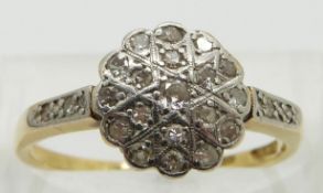 An 18ct gold ring set with diamonds in a platinum setting, size P