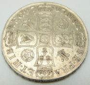 1707 Queen Anne crown, first bust, roses and plumes in angles reverse, SEXTO edge, GVF