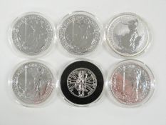 Four 2013 1oz silver Britannia two pound coins together with a 2006 example and a 1/2 oz one pound