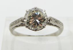 Art Deco platinum ring set with a round cut diamond of approximately 1.4ct with diamond encrusted