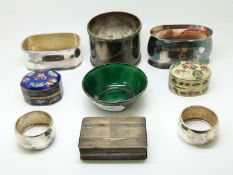 Three white metal napkin rings various marks from 800 to 835, two smaller rings and a matchbox