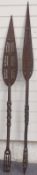 A pair of African carved ceremonial paddles/ spears, length 147cm
