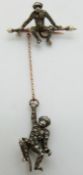 Victorian brooch depicting two monkeys, one hanging from the other, set with paste