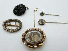 Victorian mourning brooch set with plaited hair, paste buckle, jet brooch and two stick pins