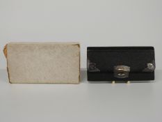 George V hallmarked silver mounted leather purse, London 1911 makers' mark HT, length 11.5cm, in