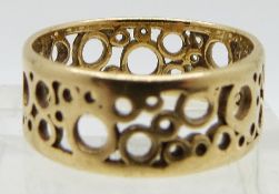 An 18ct gold ring with cut out circle design purchased at Hooper Bolton, 3.7g, size O
