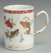 A 19thC Chinese tankard decorated with fish, height 15cm