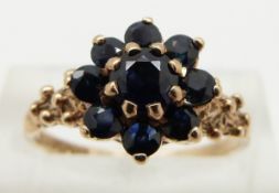 A 9ct gold ring set with sapphires in a cluster, size N