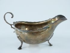 Edward VII hallmarked silver sauce boat raised on three hoof feet, Sheffield 1906 maker Harrison