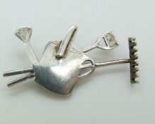 A hallmarked silver gardening themed brooch by NM