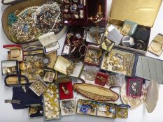 A large collection of costume jewellery including a silver one dollar, beaded necklaces, watches,