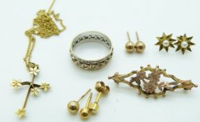A 9ct gold eternity ring, a gold brooch, a 9ct gold cross, 9ct gold chain, 9ct gold earrings etc