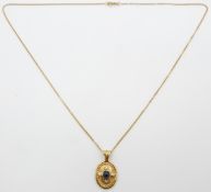 An 18ct gold pendant set with a sapphire cabochon and diamonds, 4.8g
