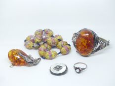 A silver bangle set with pressed amber, pressed amber pendant, silver ring, Venetian beads etc.