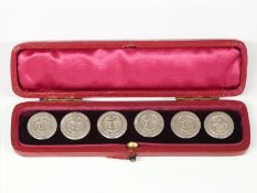 A cased set of six Edward VII hallmarked silver buttons with anchor decoration in original box,