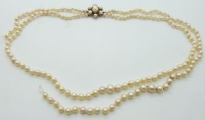 A double strand of cultured pearls with 9ct gold clasp