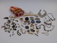 A collection of costume jewellery including large necklaces, spider brooch, Jewelcraft brooch,