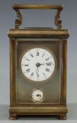 Victorian carriage alarm clock in brass case, with white enamel inset Roman dial for time and Arabic