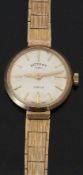 Rotary 9ct gold ladies wristwatch with gold hands and baton markers, silver dial, and signed 21